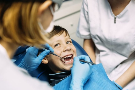 Little boy smiling at the dentist
